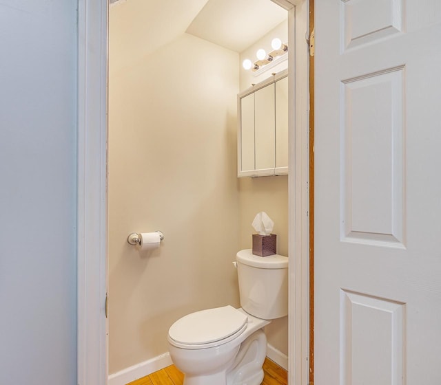415 Ferry St, La Crosse, WI 54601 - bathroom featuring baseboards, toilet, and wood finished floors