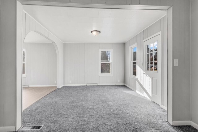 924 N Stevens St, Rhinelander, WI 54501 - spare room featuring carpet and arched walkways