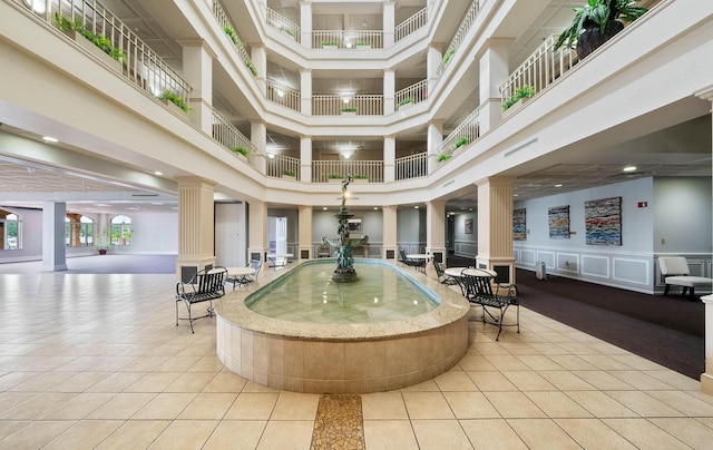 335 Wrigley Dr Unit 411, Lake Geneva, WI 53147 - building lobby with a high ceiling, a decorative wall, and recessed lighting