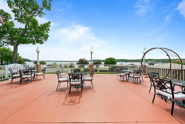 335 Wrigley Dr Unit 411, Lake Geneva, WI 53147 - view of patio / terrace featuring outdoor dining space and a water view