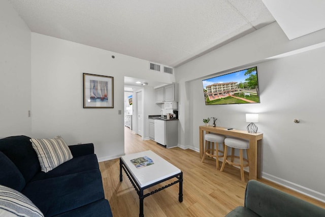 335 Wrigley Dr Unit 411, Lake Geneva, WI 53147 - living area featuring light wood-style floors and baseboards