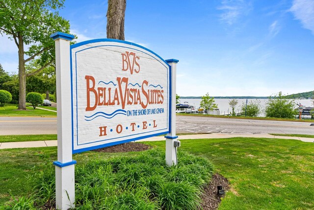 335 Wrigley Dr Unit 411, Lake Geneva, WI 53147 - community sign featuring a water view and a yard