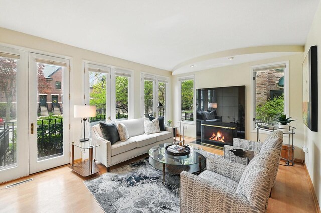 1420 N Astor St, Milwaukee, WI 53202 - living room featuring wood finished floors, a glass covered fireplace, and french doors