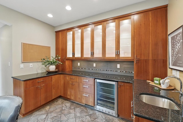 1420 N Astor St, Milwaukee, WI 53202 - bar featuring beverage cooler, a sink, light stone finish floors, tasteful backsplash, and recessed lighting