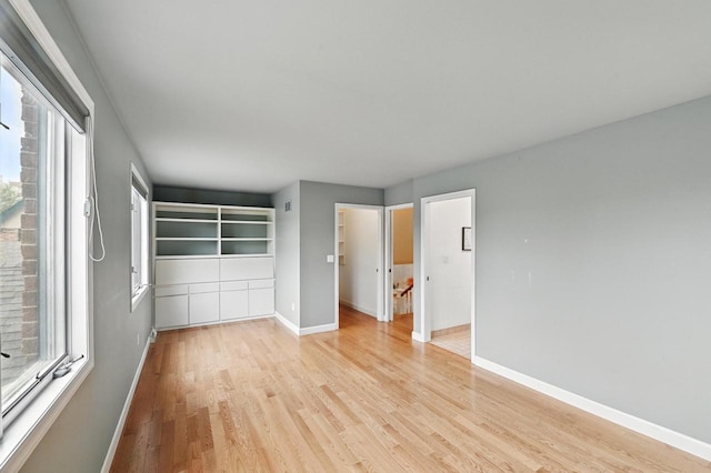 1420 N Astor St, Milwaukee, WI 53202 - unfurnished bedroom with light wood-style floors and baseboards