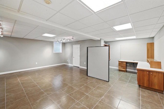 1420 N Astor St, Milwaukee, WI 53202 - below grade area with tile patterned flooring, baseboards, a drop ceiling, and rail lighting