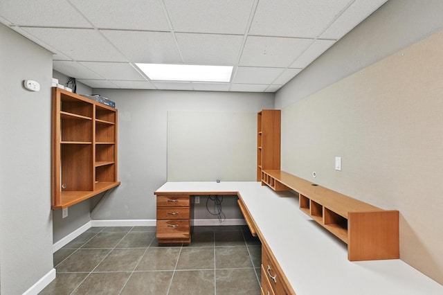 1420 N Astor St, Milwaukee, WI 53202 - unfurnished office featuring built in study area, a drop ceiling, dark tile patterned flooring, and baseboards
