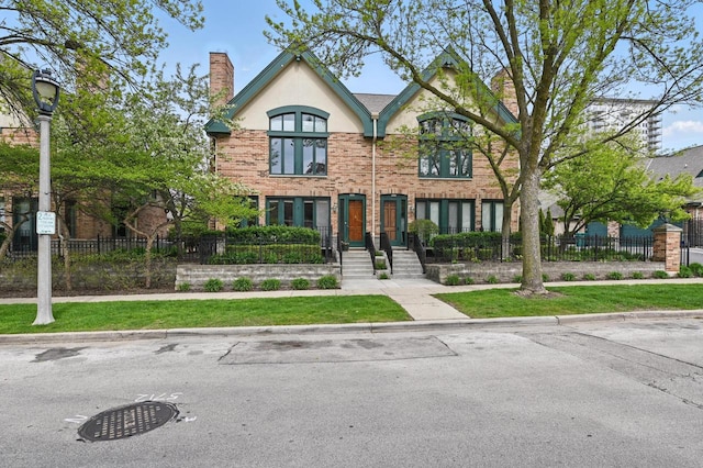 1420 N Astor St, Milwaukee, WI 53202 - view of front facade with a chimney and stucco siding