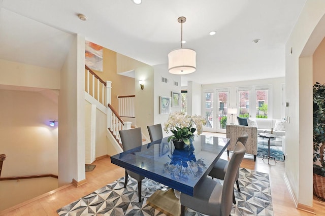 1420 N Astor St, Milwaukee, WI 53202 - dining area with light wood-style floors, stairway, recessed lighting, and baseboards