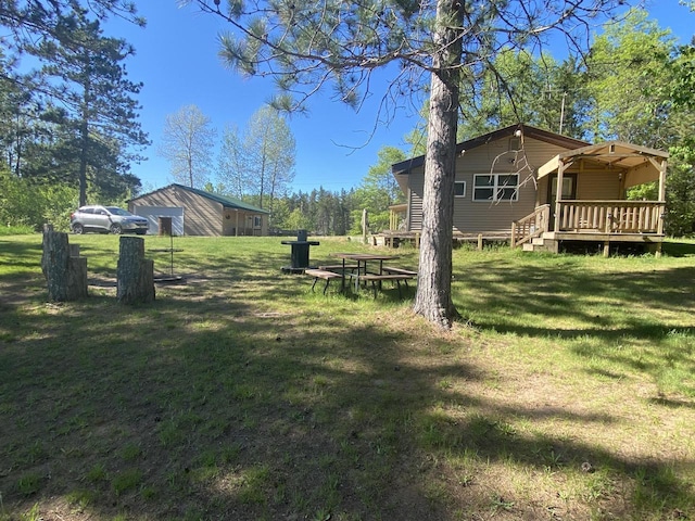 W7945 Aspen Ln, Pembine, WI 54156 - view of grassy yard with a wooden deck and a detached garage