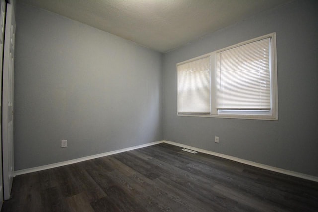 4646 N 51st Blvd, Milwaukee, WI 53218 - empty room with dark wood-style floors and baseboards