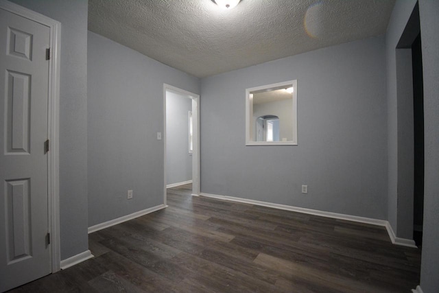 4646 N 51st Blvd, Milwaukee, WI 53218 - unfurnished room with dark wood-style flooring, a textured ceiling, and baseboards