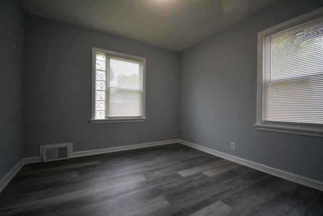 4646 N 51st Blvd, Milwaukee, WI 53218 - spare room with dark wood finished floors, baseboards, and a textured ceiling