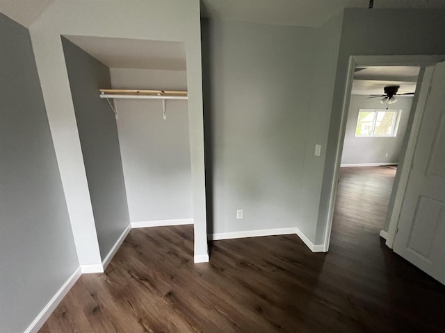 667 S Ira St, Richland Center, WI 53581 - unfurnished bedroom featuring dark wood-style flooring, baseboards, and a closet