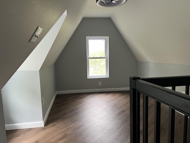 667 S Ira St, Richland Center, WI 53581 - bonus room featuring baseboards, wood finished floors, and vaulted ceiling