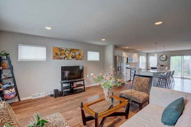 9327 Silicon Prairie Pkwy, Verona, WI 53593 - living area with baseboards, recessed lighting, and light wood finished floors