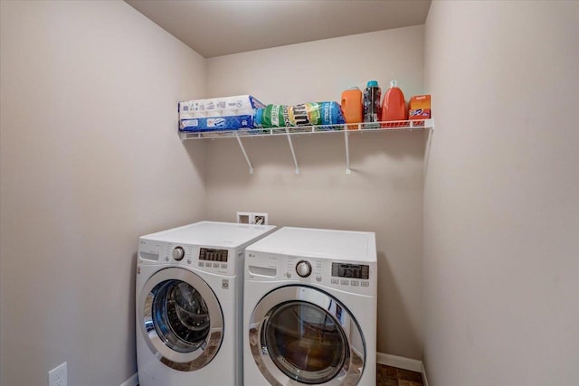 9327 Silicon Prairie Pkwy, Verona, WI 53593 - laundry room with washing machine and dryer and baseboards