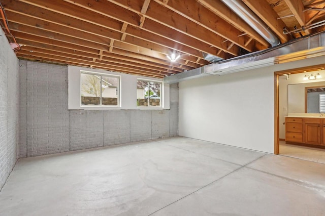 1408 Groves Ln Unit 12, Union Grove, WI 53182 - below grade area featuring brick wall