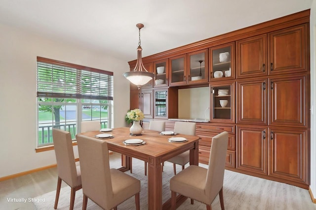 1408 Groves Ln Unit 12, Union Grove, WI 53182 - dining room featuring baseboards