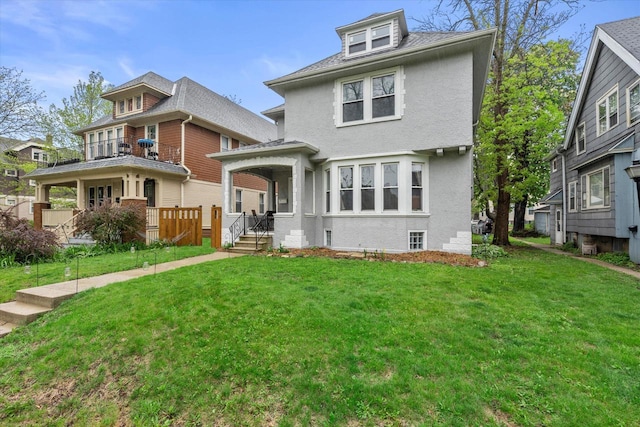 2207 N 51st St, Milwaukee, WI 53208 - view of front of house featuring stucco siding and a front yard
