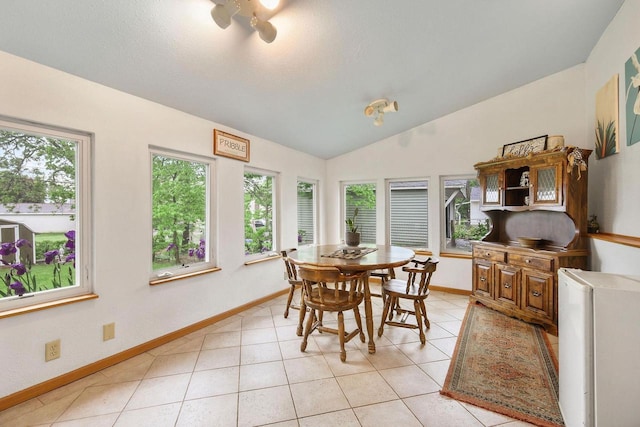 3609 Brigham Ave, Madison, WI 53714 - dining space with healthy amount of natural light, lofted ceiling, baseboards, and light tile patterned flooring