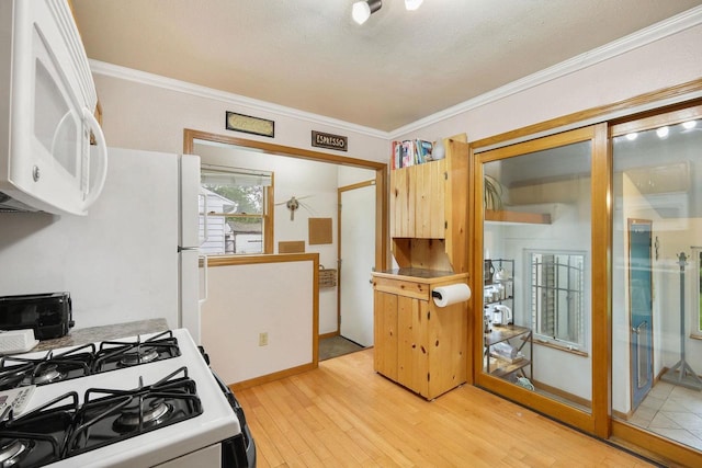 3609 Brigham Ave, Madison, WI 53714 - kitchen with white appliances, crown molding, and light wood finished floors