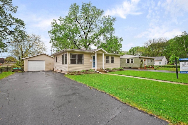 3609 Brigham Ave, Madison, WI 53714 - ranch-style home with an outbuilding, a garage, driveway, and a front lawn