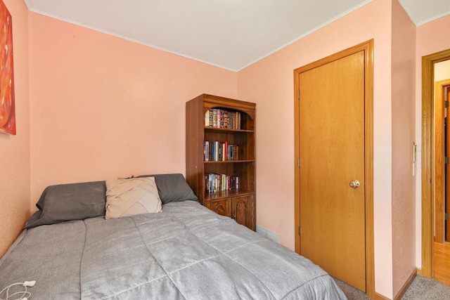 3609 Brigham Ave, Madison, WI 53714 - bedroom featuring crown molding, carpet flooring, and baseboards