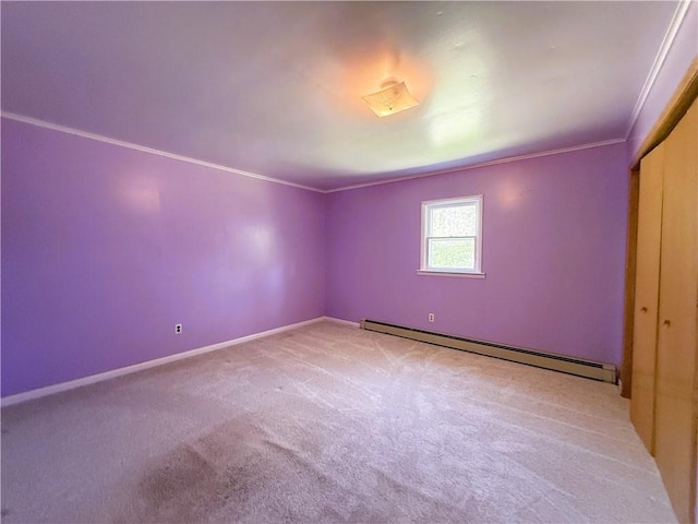 N4719 Schmidt Rd, Ladysmith, WI 54848 - empty room featuring a baseboard radiator, ornamental molding, light colored carpet, and baseboards