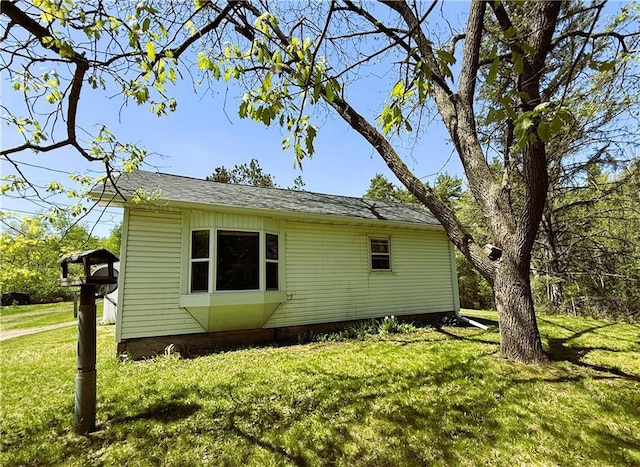 N4719 Schmidt Rd, Ladysmith, WI 54848 - view of side of home featuring a yard