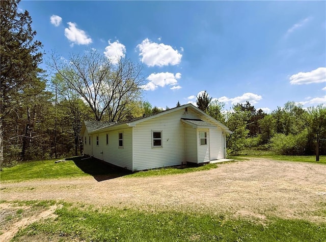 N4719 Schmidt Rd, Ladysmith, WI 54848 - back of house with a lawn and driveway