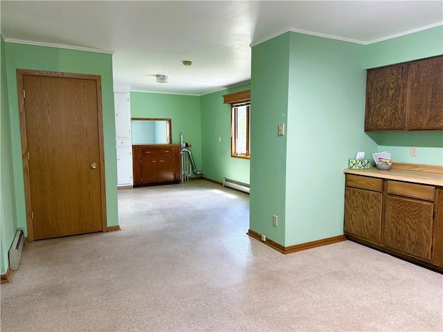 N4719 Schmidt Rd, Ladysmith, WI 54848 - kitchen with baseboard heating, baseboards, ornamental molding, light countertops, and brown cabinetry