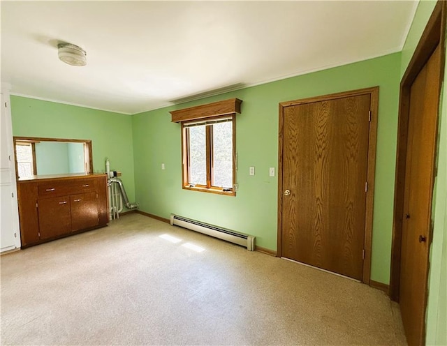 N4719 Schmidt Rd, Ladysmith, WI 54848 - unfurnished living room featuring baseboard heating, light carpet, and baseboards