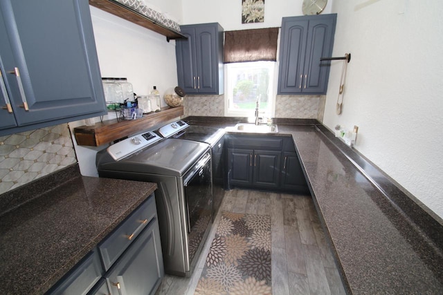 6606 Fieldstone Ct, Racine, WI 53402 - washroom featuring independent washer and dryer, cabinet space, and light wood finished floors