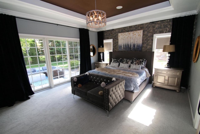 6606 Fieldstone Ct, Racine, WI 53402 - bedroom with carpet flooring, a tray ceiling, access to exterior, a chandelier, and wallpapered walls