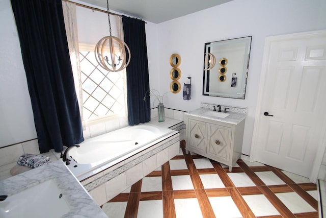 6606 Fieldstone Ct, Racine, WI 53402 - full bath featuring vanity, a chandelier, and a bath