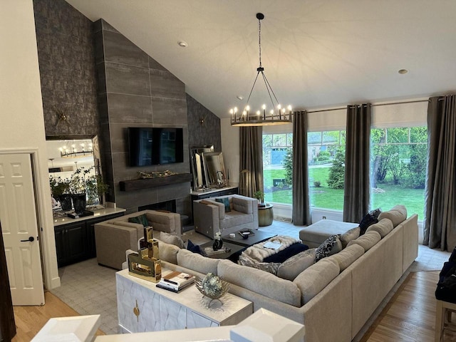 6606 Fieldstone Ct, Racine, WI 53402 - living room with plenty of natural light, light wood-style flooring, a chandelier, and high vaulted ceiling