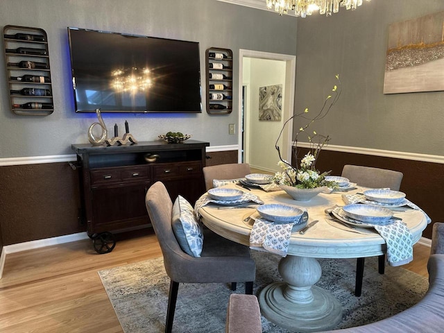 6606 Fieldstone Ct, Racine, WI 53402 - dining space with a chandelier, light wood-style flooring, and baseboards