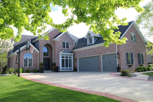 6606 Fieldstone Ct, Racine, WI 53402 - traditional-style home with driveway, a garage, a front yard, and brick siding