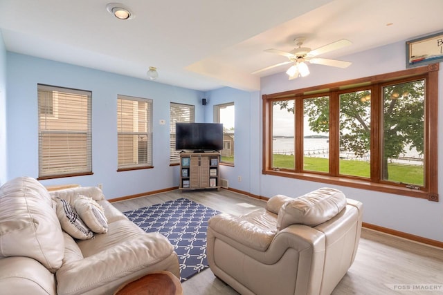 2894 Waubesa Ave, Madison, WI 53711 - living room featuring baseboards, light wood-style floors, and ceiling fan