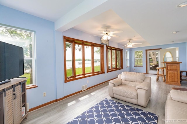 2894 Waubesa Ave, Madison, WI 53711 - living room with light wood-type flooring, baseboards, and a ceiling fan