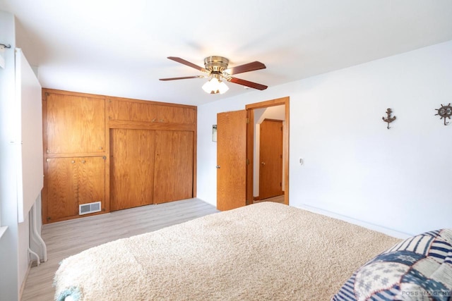 2894 Waubesa Ave, Madison, WI 53711 - bedroom with a closet, light wood-style floors, and a ceiling fan