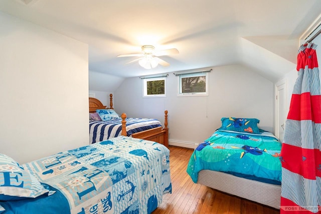 2894 Waubesa Ave, Madison, WI 53711 - bedroom with a baseboard radiator, wood-type flooring, lofted ceiling, and ceiling fan
