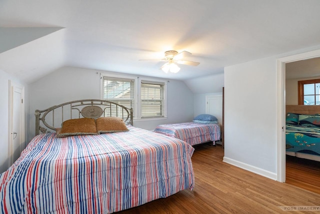 2894 Waubesa Ave, Madison, WI 53711 - bedroom featuring lofted ceiling, wood finished floors, a ceiling fan, and baseboards
