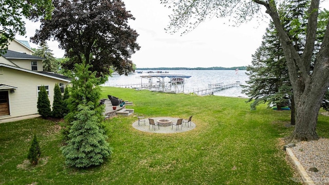 2894 Waubesa Ave, Madison, WI 53711 - view of green lawn featuring a fire pit, a water view, and a dock