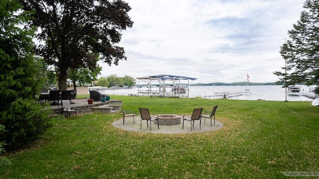2894 Waubesa Ave, Madison, WI 53711 - view of grassy yard with a fire pit and a water view