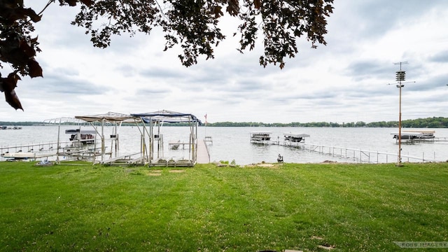 2894 Waubesa Ave, Madison, WI 53711 - dock with boat lift, a water view, and a lawn