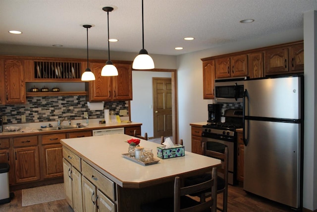421 River St, Merrimac, WI 53561 - kitchen featuring stainless steel appliances, a sink, open shelves, light countertops, and recessed lighting