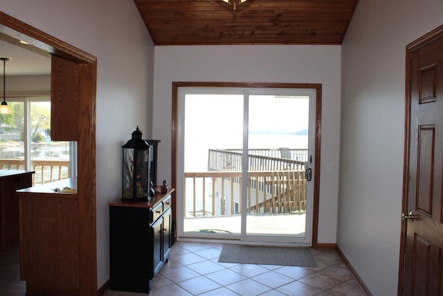 421 River St, Merrimac, WI 53561 - doorway to outside with light tile patterned flooring, baseboards, and wooden ceiling