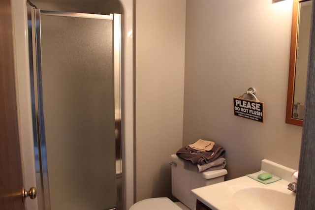 421 River St, Merrimac, WI 53561 - bathroom with a stall shower, vanity, and toilet